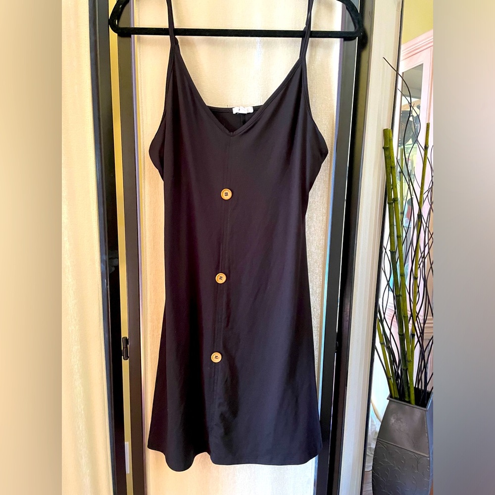 Black Sleeveless Dress with Button Accents